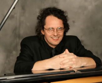 Andrew Faz sitting at the piano