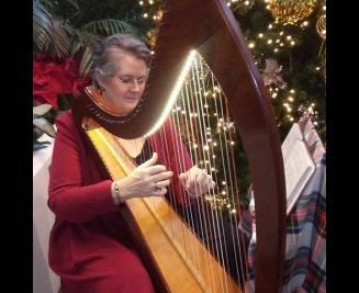 Debra playing the harp 