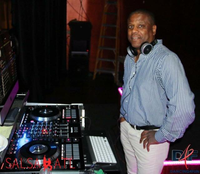 Dj Tony Unique in front of a DJ board