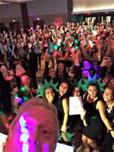 Dj rick taking a selfie in front of a happy Prom crowd