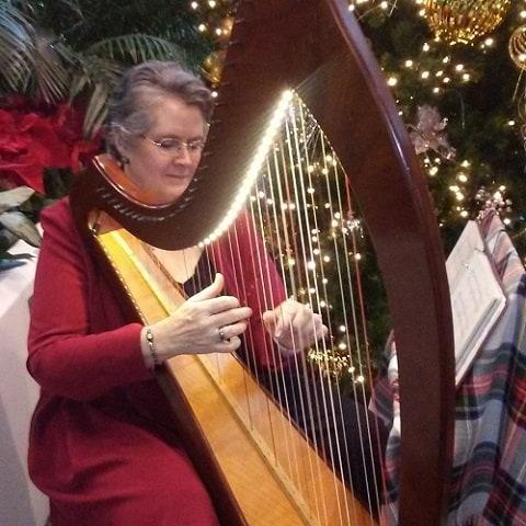 Debra playing the harp 