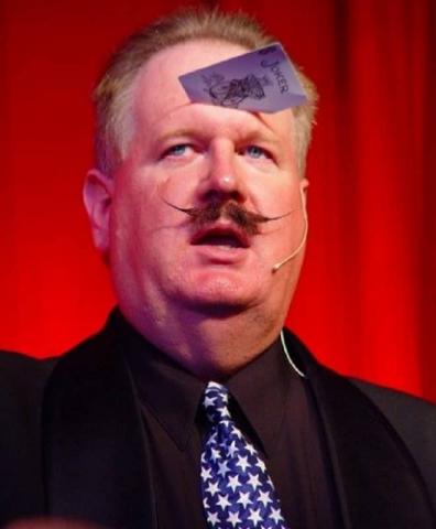 Magician Howie with a card in his forehead 