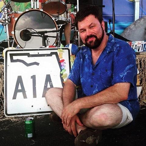 Jeff pike in front of a sign