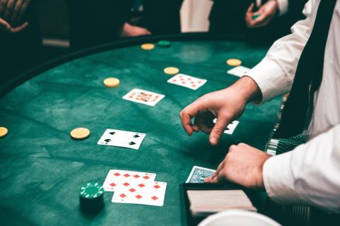 A dealer at a casino table 