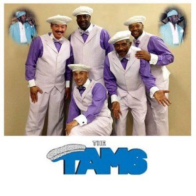The Tams in white and purple suits